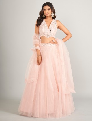 Pretty light pink net lahenga choli