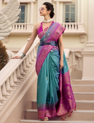 Cadet blue printed saree for festivals with unstitched blouse piece.