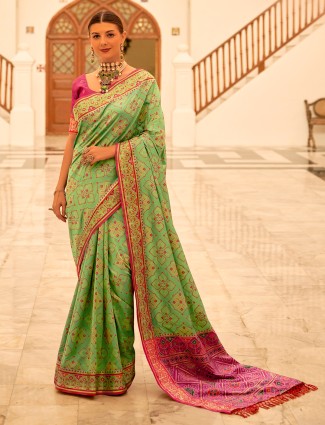 Trendy patola silk pista green saree