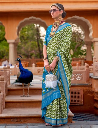 Trendy green silk saree with contrast border