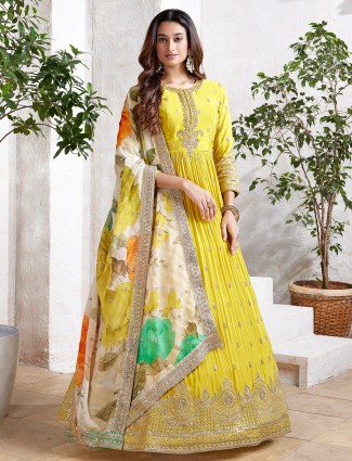 Lemon yellow anarkali salwar suit with dupatta.