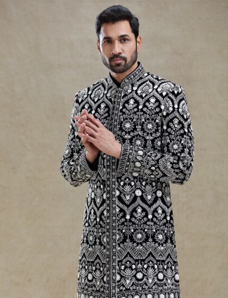 Black rich intricate worked velvet long sherwani for men