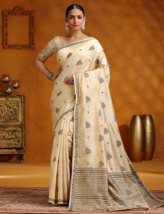 Beige silk saree with artistic motif design