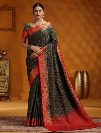 Dark green silk saree with contrasting red border