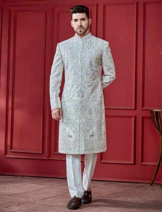 Ivory silk sherwani paired with churidar