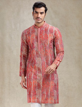 Elegant rust orange kurta suit featuring detailed artisanal work