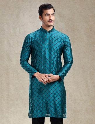 Vibrant peacock blue kurta ensemble crafted from satin silk