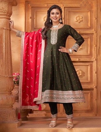 Mehendi green silk salwar suit with bold red dupatta