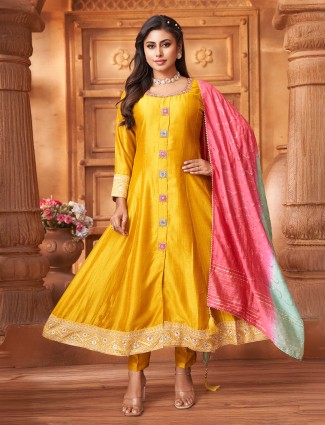 Yellow silk salwar suit highlighted with shaded dupatta
