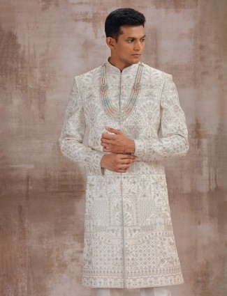 Cream art silk wedding sherwani for the groom