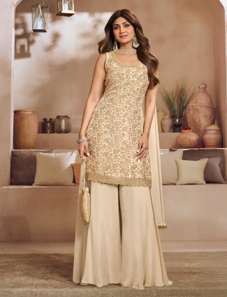 Beige silk palazzo set with zari highlights for festive