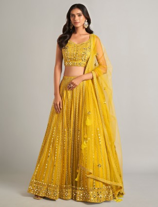 Trendy yellow net lehenga choli