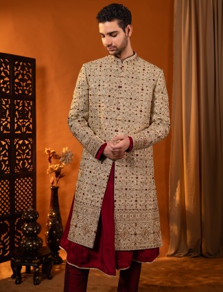 Golden and maroon sherwani in rich silk for groom