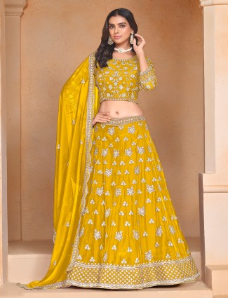 Elegant yellow organza lehenga choli with blouse and dupatta