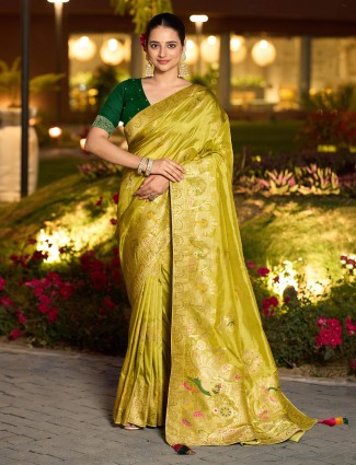 Graceful mustard yellow dola silk saree with stones