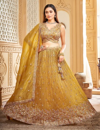 Mustard yellow silk lehenga choli with resham embroidery