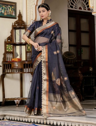 Graceful navy linen saree featuring rich zari weaving