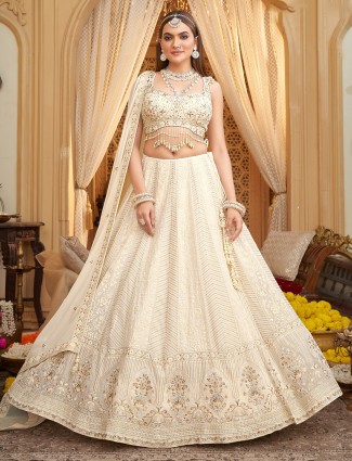 Silk off white lehenga choli with beads and shells