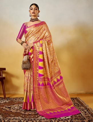 Festive pink silk saree with ornate zari weaving