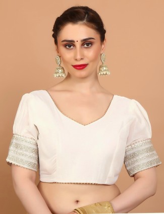 Cream silk V neck blouse adorned with sequins