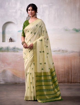 Beige cotton saree with attractive green motifs