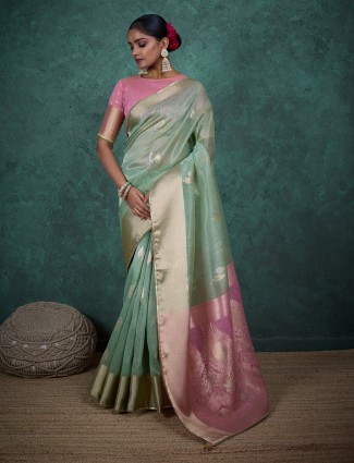 Graceful zari woven pista green linen saree