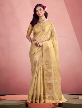 Cream tissue silk saree for festive occasions