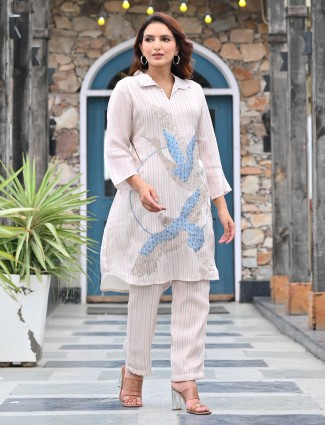 White striped suit with contemporary quarter sleeves