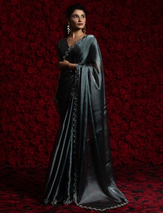 Dark grey chiffon saree adorned with cutdana work