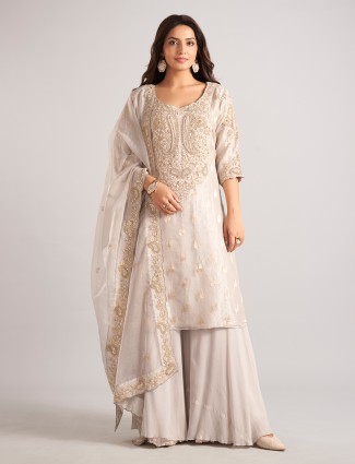 Cream silk palazzo suit with zardosi and cutdana work