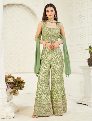 Bright green silk suit with sparkling ornamentation