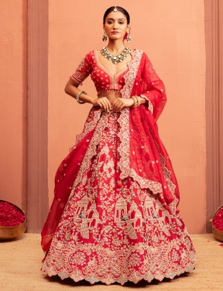 Red bridal lehenga choli in raw silk fabric embroidered