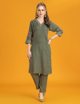 Green silk kurti set with thread accents