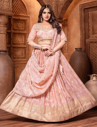 Elegant peach lehenga crafted for modern receptions