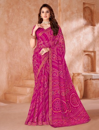 Rani pink chiffon saree with charming printed detailing
