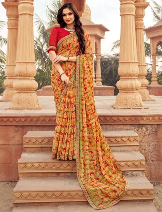 Orange chiffon printed sarees with stone embellishment