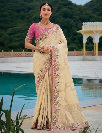 Beige silk wedding wear embroidered saree
