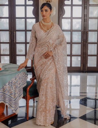 Peach sequins worked net saree