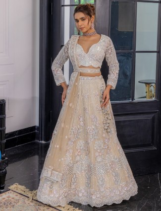 Peach net lehenga choli for reception wear