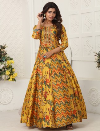 Bright yellow dola silk floor length suit with beautiful prints