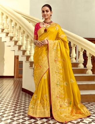 Yellow silk saree enhanced with zari work