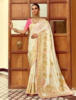 Beige silk saree featuring elegant zari embellishments