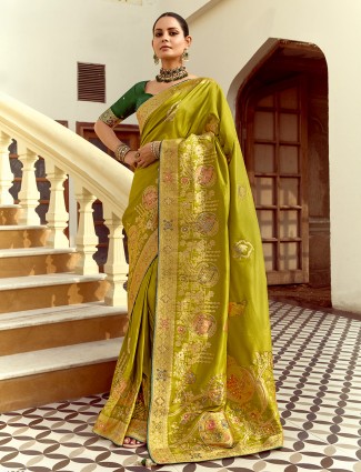 Green silk saree adorned with zari work