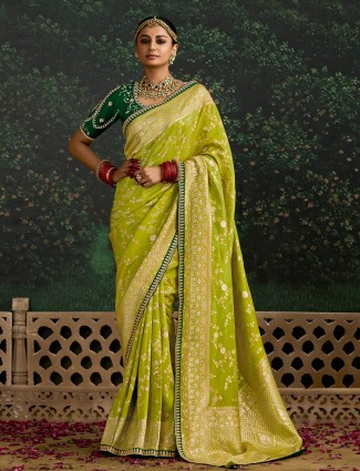 Lime green dola silk saree enhanced with zari weaving