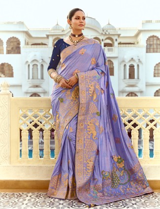 Purple silk saree featuring intricate zari designs