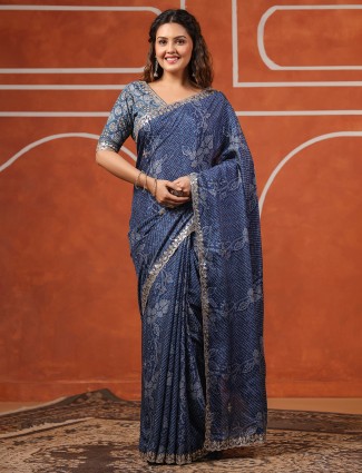 Trendy blue muslin saree with floral patterns