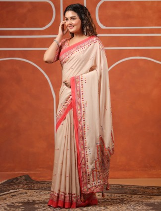 Cream muslin saree with soft printed motifs for women