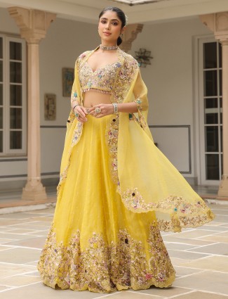 Shrug style mustard yellow organza lehenga choli