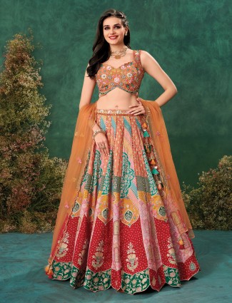Burnt orange raw silk lehenga for grand wedding celebrations