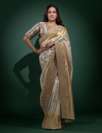 Off white ziraf silk embellished saree with grand border